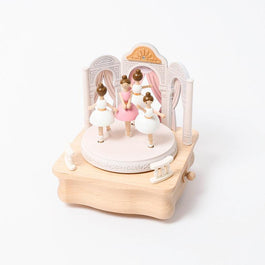 wooden music box with four ballerinas